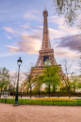 Fototapeta na wymiar Sunny morning in the park at Eiffel Tower, Paris, France