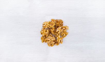 Walnuts, Juglans. dried fruits for happy
Tu Bishvat.
Healthy natural food with lots of minerals and vitamins. On a white background wooden texture. from above top View with free space for text

