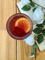 Summer drink with orange and strawberry