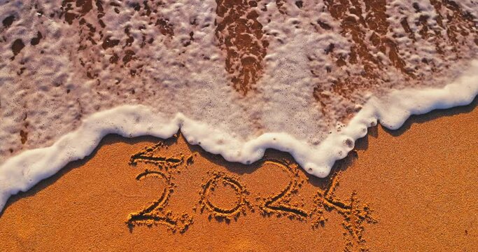 Wave lapped the sandy beach shore with handwritten text 2024 year, Summer Travel Background