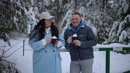 Man and woman having fun in winter park while meeting