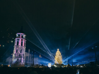 Vilnius, Lithuania - 01 01 2024: Celebrating the New Year 2024 on Cathedral Square in Vilnius. New Year's laser show near the main Christmas tree