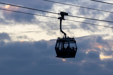 2023 Dec 30,Hong Kong.Ngong Ping 360 cable car on Tung Chung ,Lantau Island, Hong Kong. Cable car just leave the Tung Chung City.