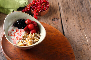 healthy eating cereal porridge with berries for breakfast