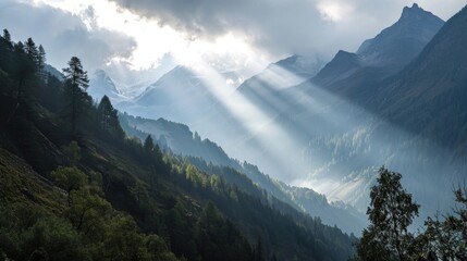 The Beauty of Sunlight Breaking Through Clouds in the Majestic Mountains