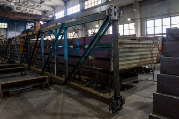 Kyiv, Ukraine - 15.06.2022: Various metal structures cut in the workshop. The factory produces metal parts, elements, and structures. Plant for the production of metal structures.