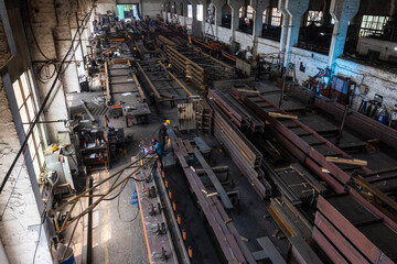 Kyiv, Ukraine - 15.06.2022: Various metal structures cut in the workshop. The factory produces metal parts, elements, and structures. Plant for the production of metal structures. - 702244557