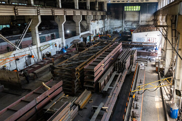 Kyiv, Ukraine - 15.06.2022: Various metal structures cut in the workshop. The factory produces metal parts, elements, and structures. Plant for the production of metal structures. - 702245143
