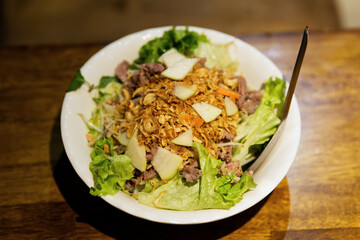 Bum Bo Nam Bo, a traditional Vietnamese noodle dish at street food stall. A popular beef noodle dish in Vietnam