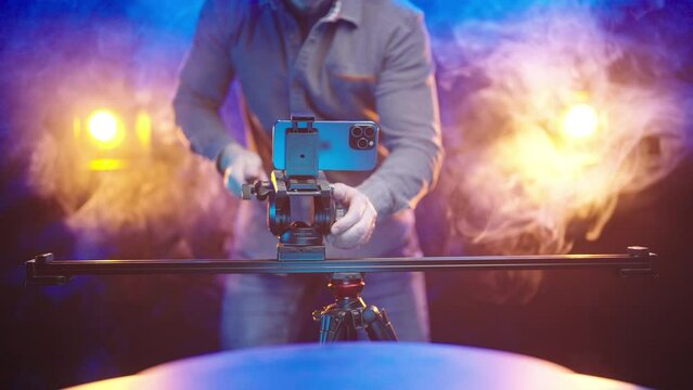 Professional video production setup with multi-camera smartphone on slider 4K