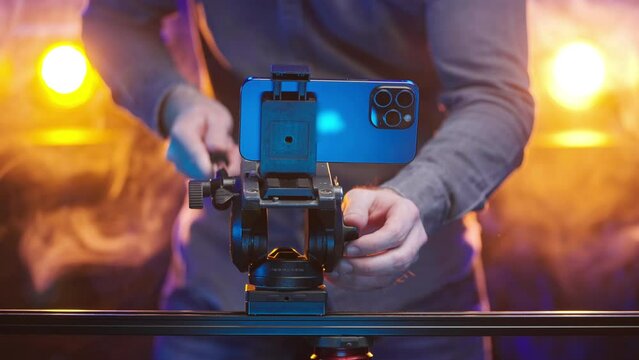 Headless person use multi-camera smartphone for shooting movie 4K