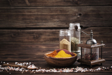 spices on old dark wooden background