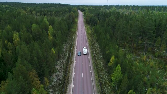 Caravan Camping driving on E45 Higway Road through the wilderness of middle Sweden between the towns of Malung