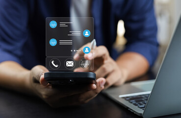 Businessman using AI chatbot conversation assistant in app on device for virtual assistance and customer support digital communication, Contact us Online service with AI Chatbot for efficient support.