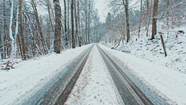 Driving Through Scenic Winter Forest on Slushy Snow Covered Icy Road Dashcam POV