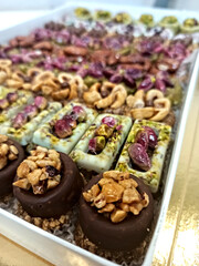 Obraz premium Lille, December 2023 - Food trays prepared for a thesis presentation - Tunisian pastries