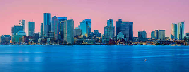 Boston City Skyline Panorama at Sunrise. Boston Harbor and Financial District Skyscrapers viewed from Piers Park in Massachusetts, USA.