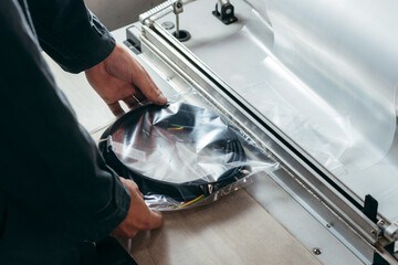 Worker's hands with heat shrink