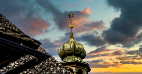 Church tower at sunset with 2 birds, Maria Saal, Carinthia