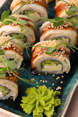 Assorted sushi nigiri and maki big set on slate. A variety of Japanese sushi with tuna, crab, salmon, eel and rolls. Top view