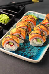 Assorted sushi nigiri and maki big set on slate. A variety of Japanese sushi with tuna, crab, salmon, eel and rolls. Top view