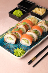 Assorted sushi nigiri and maki big set on slate. A variety of Japanese sushi with tuna, crab, salmon, eel and rolls. Top view