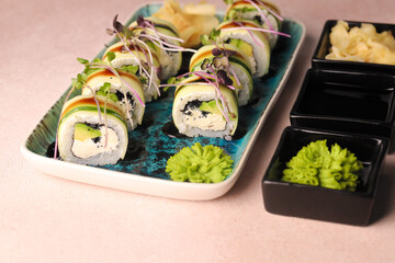 Assorted sushi nigiri and maki big set on slate. A variety of Japanese sushi with tuna, crab, salmon, eel and rolls. Top view