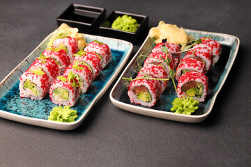 Assorted sushi nigiri and maki big set on slate. A variety of Japanese sushi with tuna, crab, salmon, eel and rolls. Top view