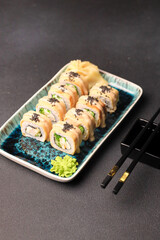 Assorted sushi nigiri and maki big set on slate. A variety of Japanese sushi with tuna, crab, salmon, eel and rolls. Top view