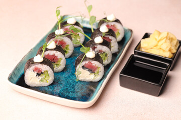 Assorted sushi nigiri and maki big set on slate. A variety of Japanese sushi with tuna, crab, salmon, eel and rolls. Top view