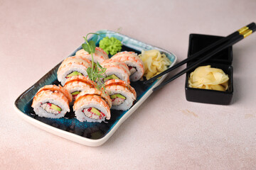 Assorted sushi nigiri and maki big set on slate. A variety of Japanese sushi with tuna, crab, salmon, eel and rolls. Top view