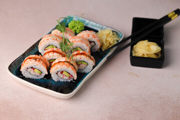 Assorted sushi nigiri and maki big set on slate. A variety of Japanese sushi with tuna, crab, salmon, eel and rolls. Top view