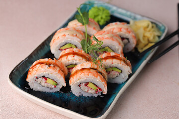 Assorted sushi nigiri and maki big set on slate. A variety of Japanese sushi with tuna, crab, salmon, eel and rolls. Top view