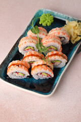 Assorted sushi nigiri and maki big set on slate. A variety of Japanese sushi with tuna, crab, salmon, eel and rolls. Top view