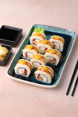 Assorted sushi nigiri and maki big set on slate. A variety of Japanese sushi with tuna, crab, salmon, eel and rolls. Top view