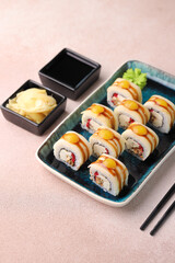 Assorted sushi nigiri and maki big set on slate. A variety of Japanese sushi with tuna, crab, salmon, eel and rolls. Top view