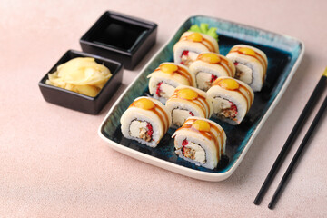 Assorted sushi nigiri and maki big set on slate. A variety of Japanese sushi with tuna, crab, salmon, eel and rolls. Top view