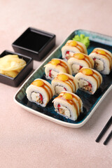 Assorted sushi nigiri and maki big set on slate. A variety of Japanese sushi with tuna, crab, salmon, eel and rolls. Top view