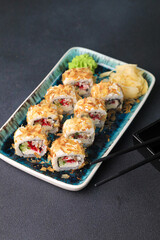 Assorted sushi nigiri and maki big set on slate. A variety of Japanese sushi with tuna, crab, salmon, eel and rolls. Top view