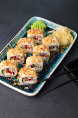 Assorted sushi nigiri and maki big set on slate. A variety of Japanese sushi with tuna, crab, salmon, eel and rolls. Top view