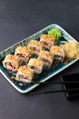 Assorted sushi nigiri and maki big set on slate. A variety of Japanese sushi with tuna, crab, salmon, eel and rolls. Top view