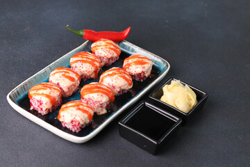 Assorted sushi nigiri and maki big set on slate. A variety of Japanese sushi with tuna, crab, salmon, eel and rolls. Top view