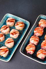 Assorted sushi nigiri and maki big set on slate. A variety of Japanese sushi with tuna, crab, salmon, eel and rolls. Top view