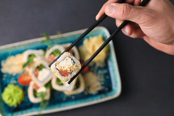 Assorted sushi nigiri and maki big set on slate. A variety of Japanese sushi with tuna, crab, salmon, eel and rolls. Top view