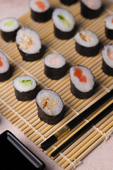 Assorted sushi nigiri and maki big set on slate. A variety of Japanese sushi with tuna, crab, salmon, eel and rolls. Top view