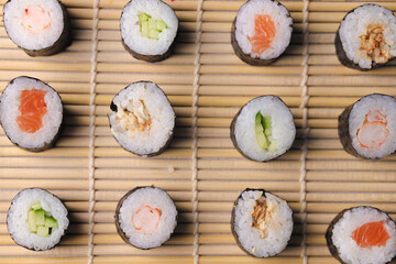 Assorted sushi nigiri and maki big set on slate. A variety of Japanese sushi with tuna, crab, salmon, eel and rolls. Top view