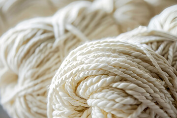 White skeins of warm yarn close up.