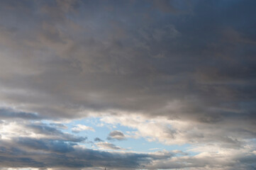 Thick stratocumuliform clouds at sunset.