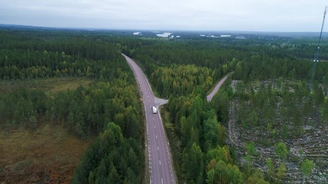 Caravan Camping driving on E45 Higway Road through the wilderness of middle Sweden between the towns of Malung and Oje
