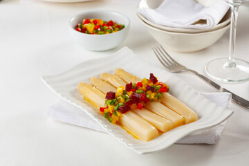 Asparagus with colored pepper and beet vinaigrette.